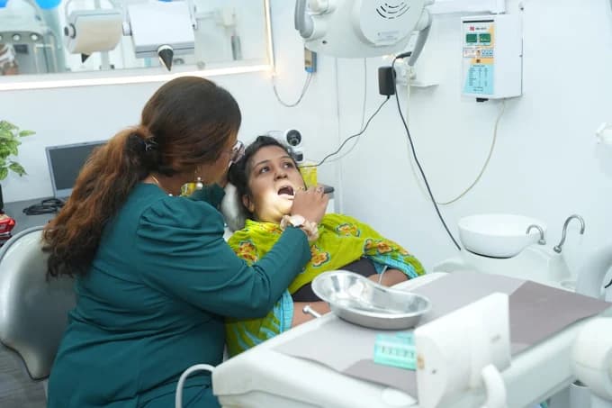 Doctor inspecting a dental patient at Sai Arogyam Dental Clinic in Lohegaon Pune